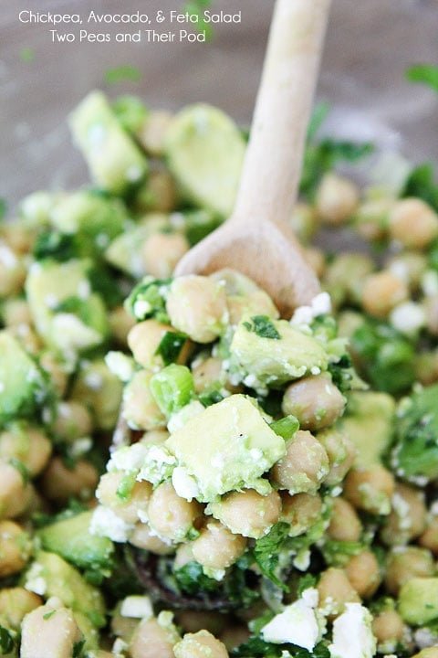 Easy Chickpea, Avocado, & Feta Salad Recipe on twopeasandtheirpod.com Chickpea, Avocado, & Feta Salad on wood spoon.