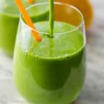 Green smoothie poured into glass cup
