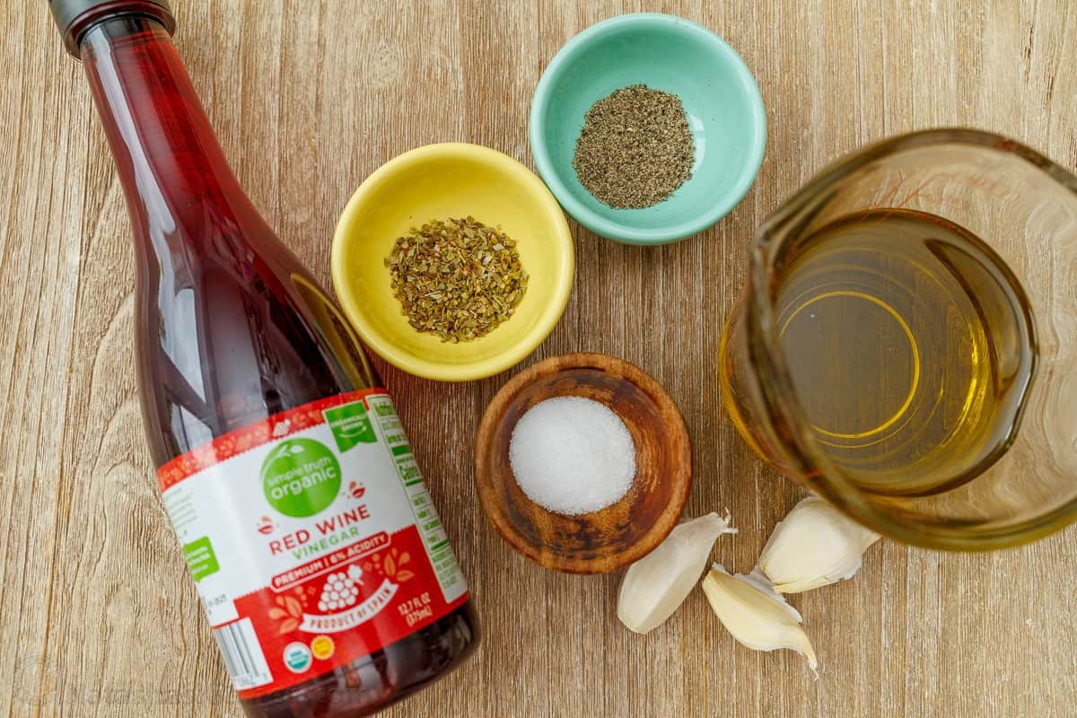 Ingredients for Greek salad dressing Ingredients for Greek salad dressing: red wine vinegar, oregano, pepper, salt, garlic, cloves, and extra virgin olive oil