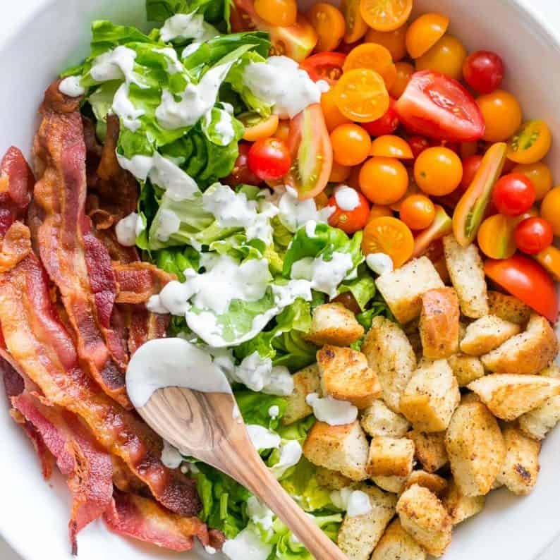 A BLT Salad loaded with fresh lettuce, crispy bacon, bright tomatoes, crunchy croutons and the BLT Salad dressing is exceptional. Easy, excellent salad! | natashaskitchen.com