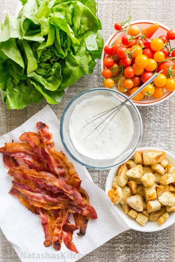 A BLT Salad loaded with fresh lettuce, crispy bacon, bright tomatoes, crunchy croutons and the BLT Salad dressing is exceptional. Easy, excellent salad! | natashaskitchen.com
