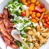 A BLT Salad loaded with fresh lettuce, crispy bacon, bright tomatoes, crunchy croutons and the BLT Salad dressing is exceptional. Easy, excellent salad! | natashaskitchen.com