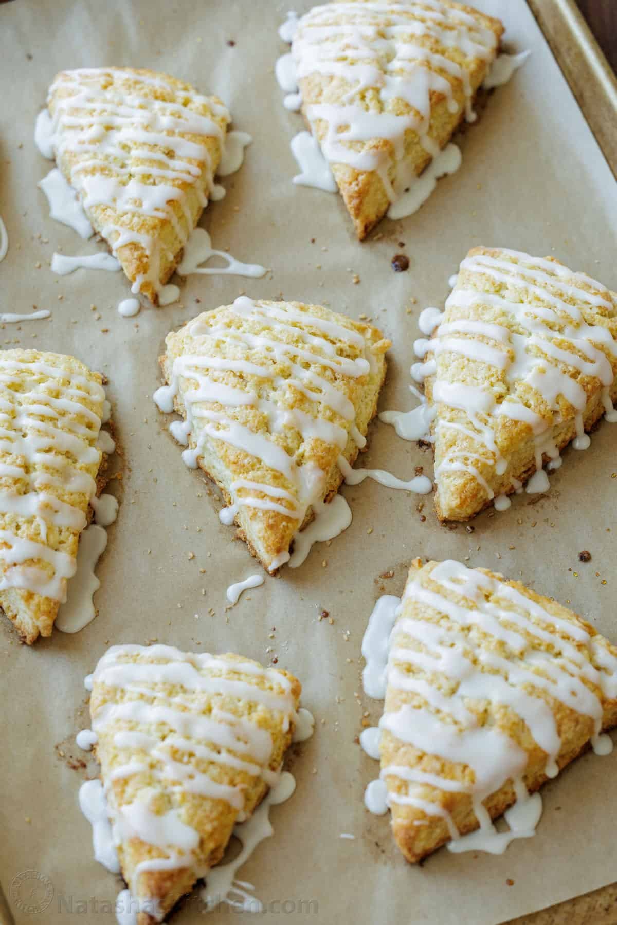 This classic Scone recipe is the perfect base for any homemade scones. Create delicious variations that will rival your favorite coffee shop scones. English scone wedges drizzled with vanilla glaze