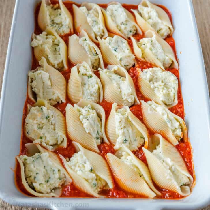 Shells stuffed and arranged in a casserole dish