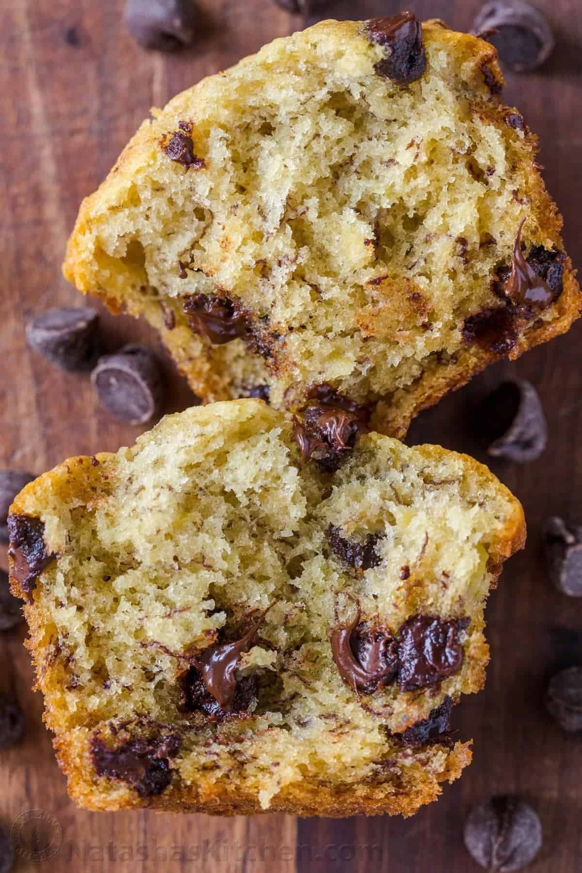 Easy Banana Muffins with chocolate chips are the ultimate treat. Our best banana chocolate chip muffins are a great way to use ripe bananas! Banana chocolate chip muffin cut in half to see melty chocolate and soft center