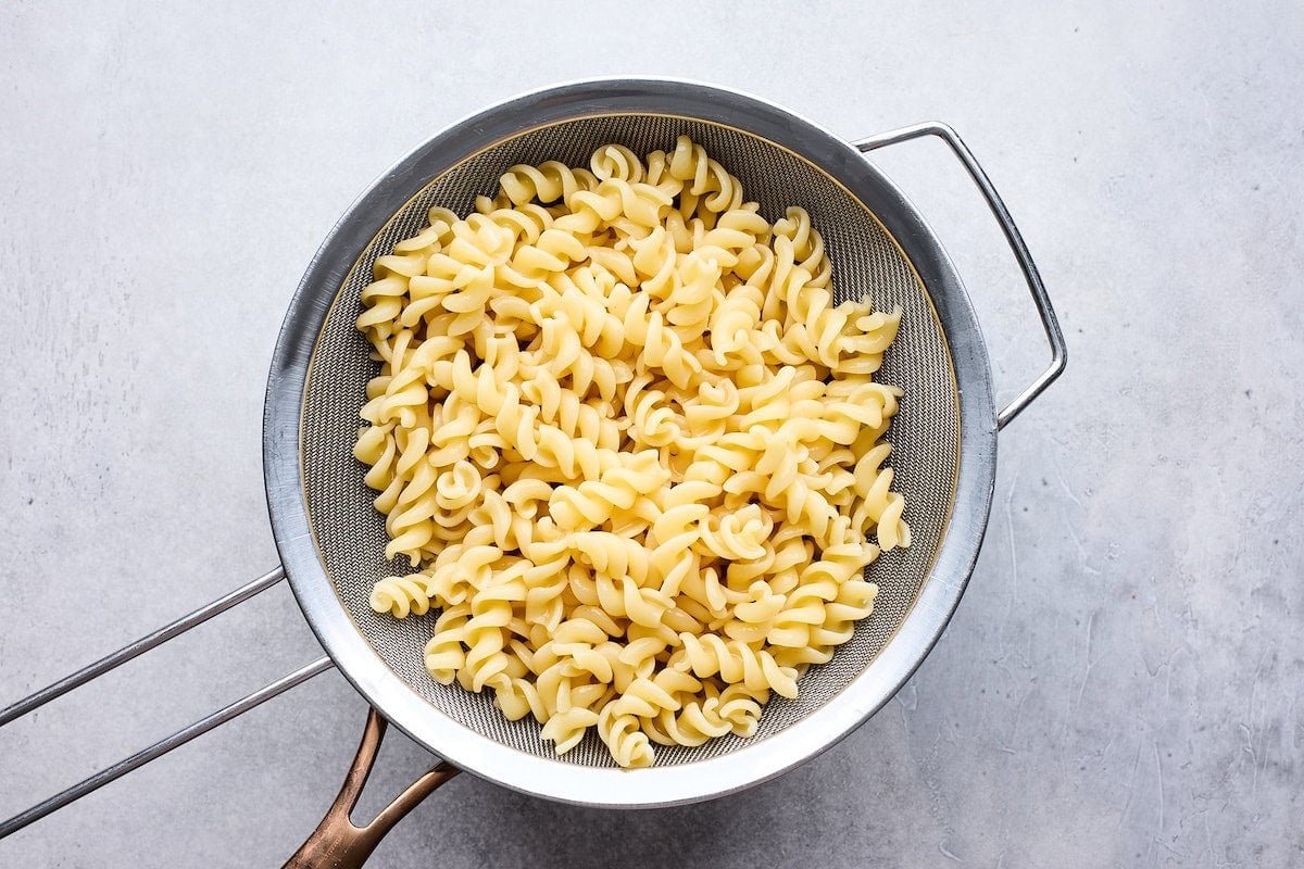 pasta draining in colander.