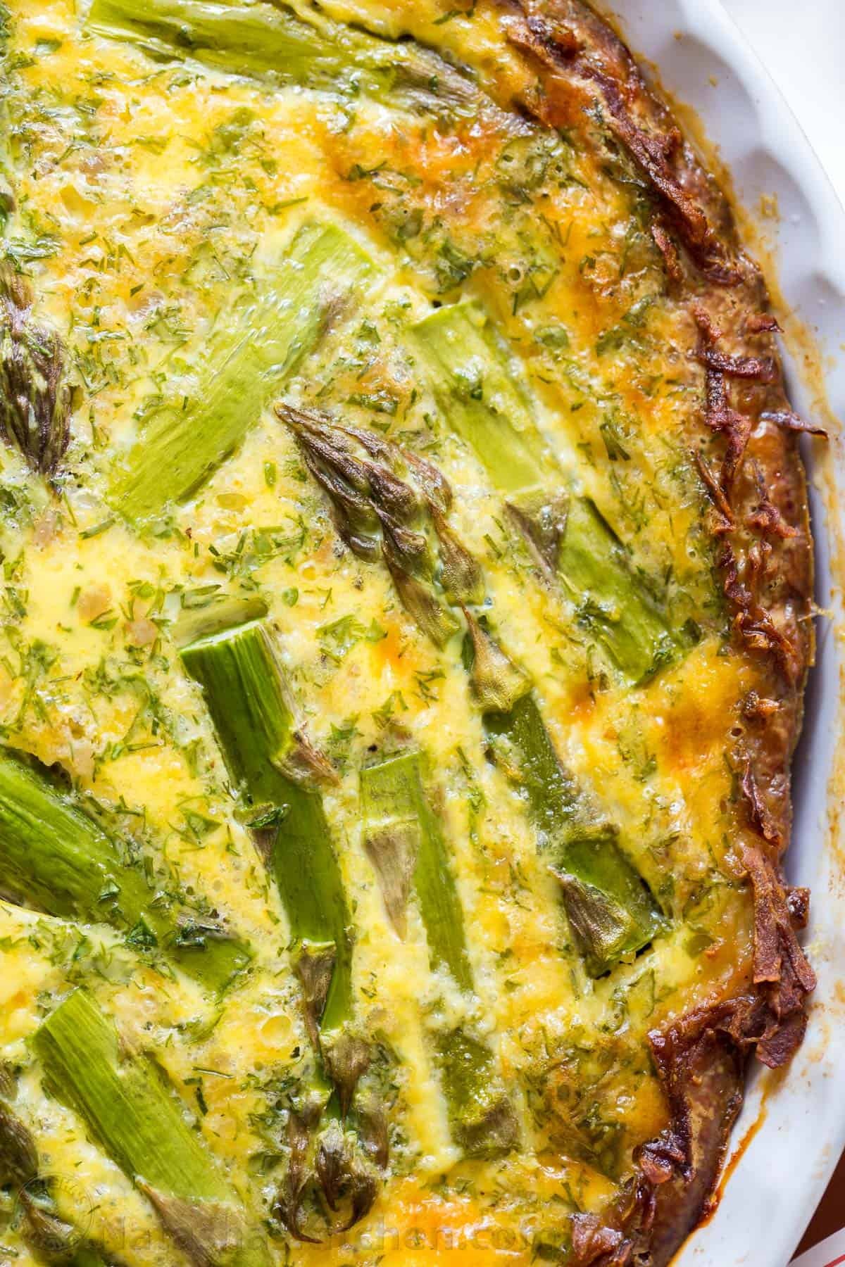 Every bite of this Sausage Asparagus Quiche is pure comfort. This classic quiche recipe is loaded with juicy sausage, eggs, fresh asparagus and herbs. | natashaskitchen.com
