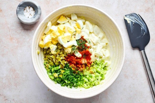 potato salad ingredients in bowl.