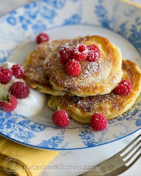 You must try these simple yet delicious Ukrainian syrniki with Farmer's cheese. They known as tvorog pancakes. Soft on the inside, golden outside. Yum!
