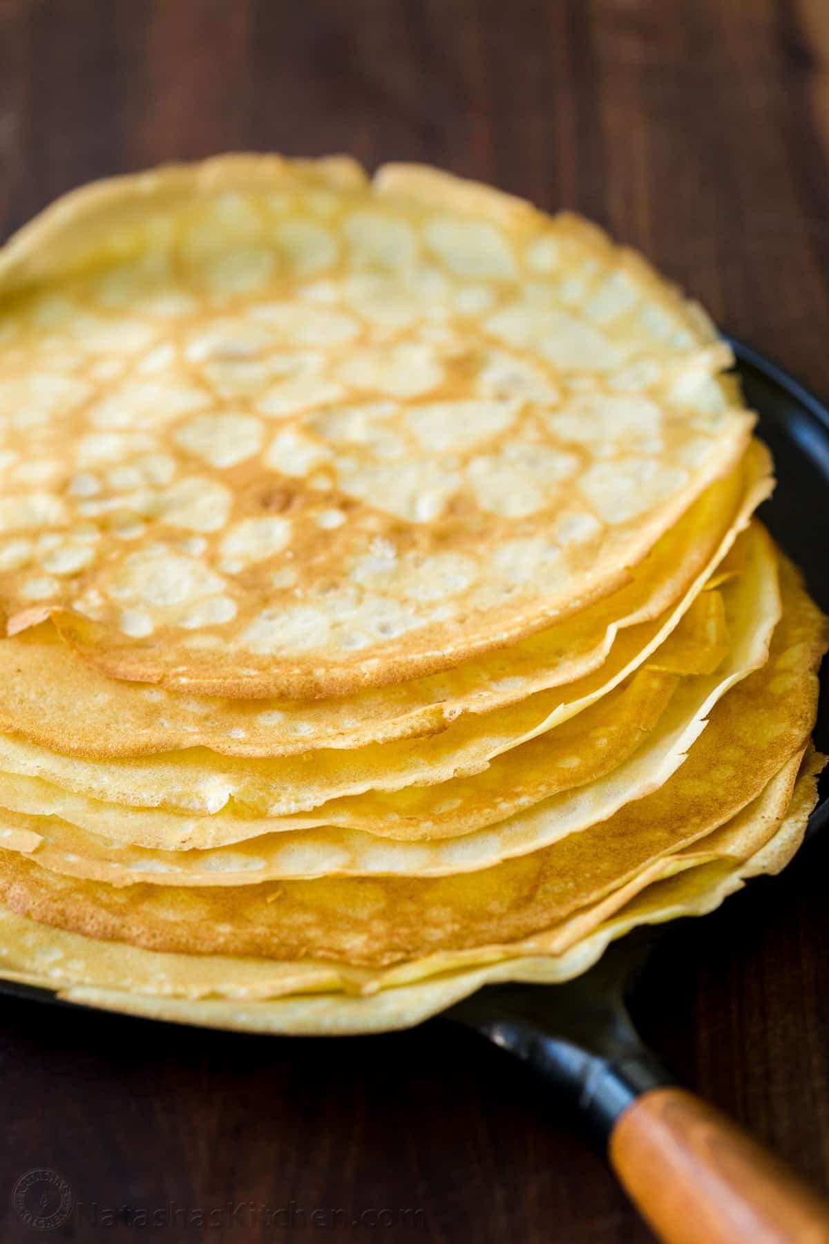 Stack of crepes on a skillet