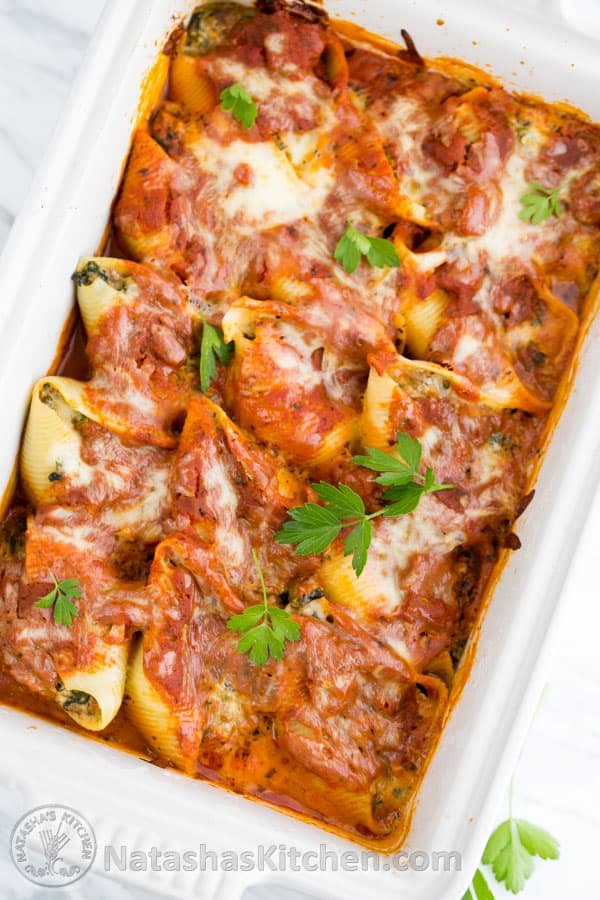 These lasagna stuffed shells are easier than making lasagna but are just as satisfying! @natashaskitchen