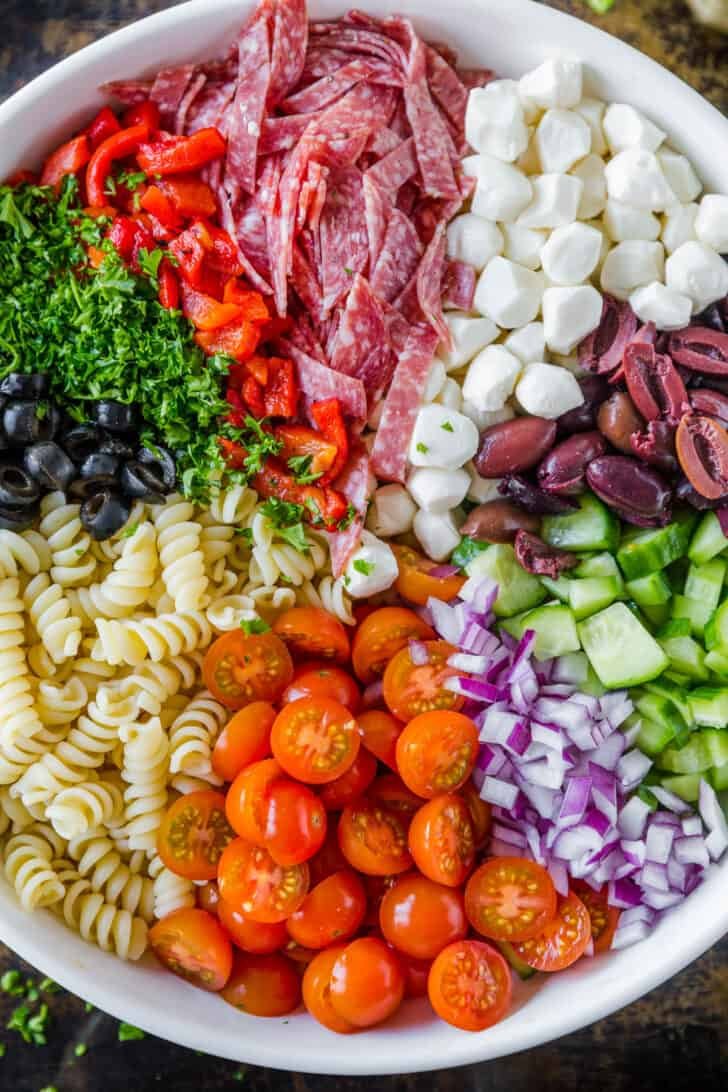 The best pasta salad with rotini pasta and other pasta salad ingredients arranged in mixing bowl