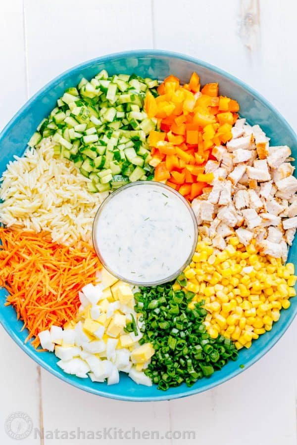 This chicken pasta salad is loaded, hearty and satisfying. The creamy lemon dill dressing adds fresh amazing flavor. This pasta salad is so tasty! | natashaskitchen.com