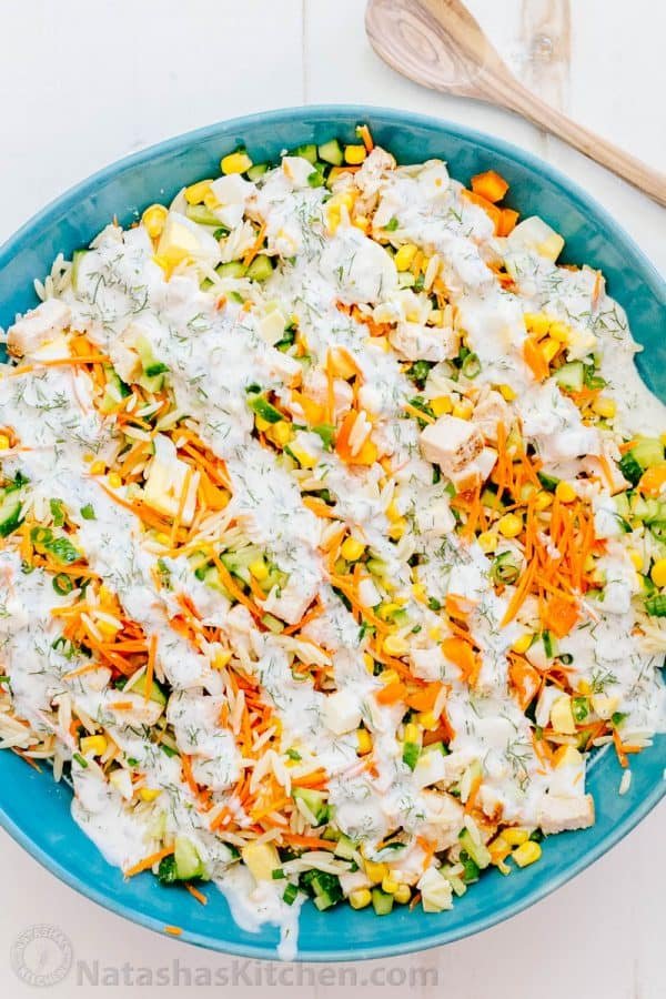 This chicken pasta salad is loaded, hearty and satisfying. The creamy lemon dill dressing adds fresh amazing flavor. This pasta salad is so tasty! | natashaskitchen.com