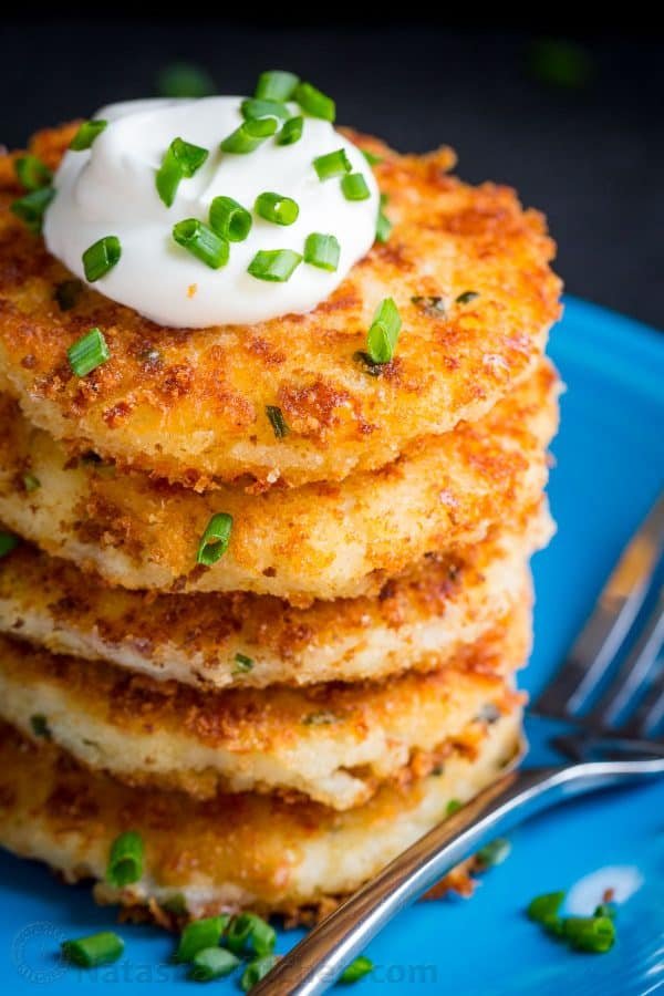 Cheesy mashed potato pancakes recipe - best way to use up leftover mashed potatoes! Mashed Potato Pancakes are crispy outside and loaded with melty cheese! | natashaskitchen.com