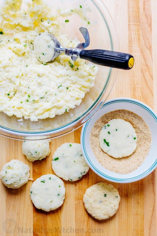 Cheesy mashed potato pancakes recipe - best way to use up leftover mashed potatoes! Mashed Potato Pancakes are crispy outside and loaded with melty cheese! | natashaskitchen.com