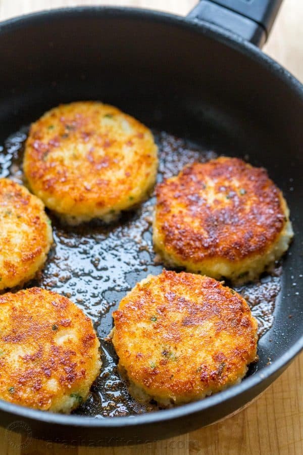 Cheesy mashed potato pancakes recipe - best way to use up leftover mashed potatoes! Mashed Potato Pancakes are crispy outside and loaded with melty cheese! | natashaskitchen.com