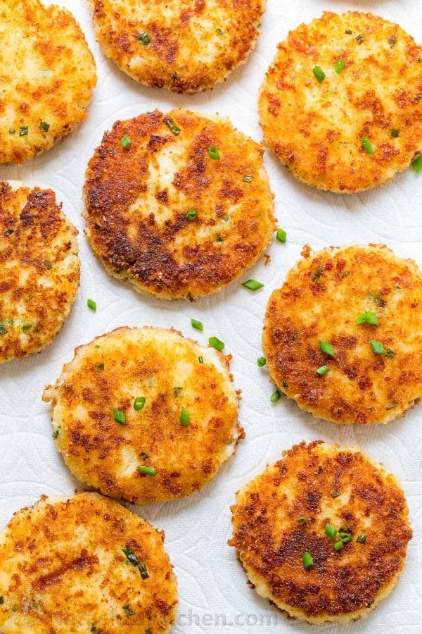 Cheesy mashed potato pancakes recipe - best way to use up leftover mashed potatoes! Mashed Potato Pancakes are crispy outside and loaded with melty cheese! | natashaskitchen.com