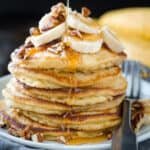 Banana pancakes stacked on a plate