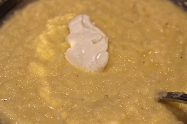A bowl of potato pancake mixture in a bowl 