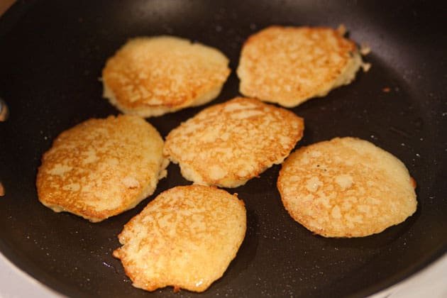 These potato pancakes have finely grated, raw potatoes and onion. It's a classic Ukrainian dish called Deruny. Our moms still make these deruny regularly.