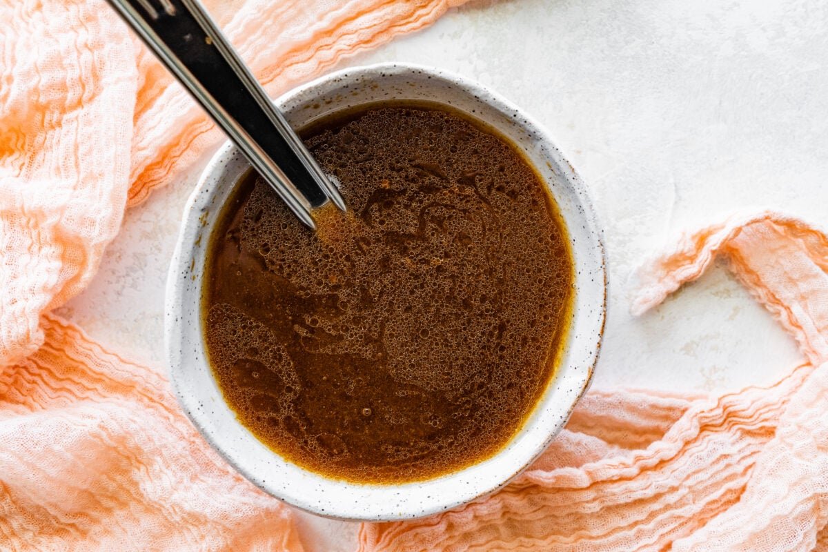 soy ginger dressing in bowl with spoon. 