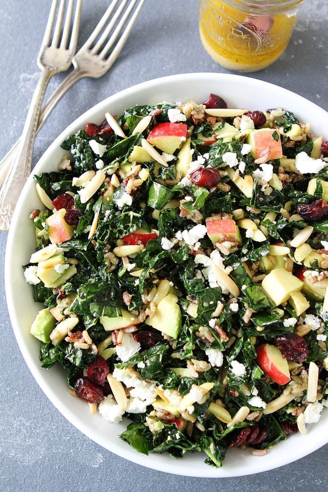 Kale and Wild Rice Salad Recipe on twopeasandtheirpod.com Kale salad with wild rice, apples, avocado, dried cranberries, goat cheese, and almonds. This hearty salad is my absolute favorite! Kale and Wild Rice Salad Recipe