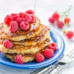 Stack of cottage cheese pancakes drizzled with syrup