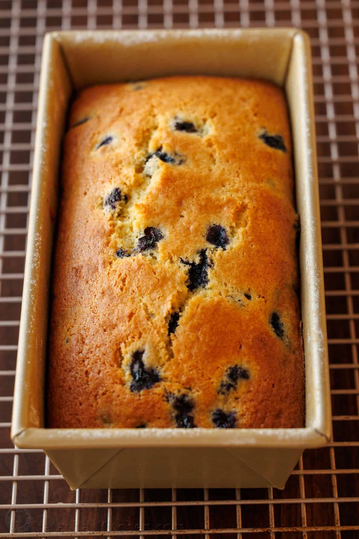 This Lemon Blueberry Bread has a moist and tender crumb and is loaded with blueberries. Don't skip the lemon glaze - you'll love every bite! Blueberry Bread baked in a loaf pan