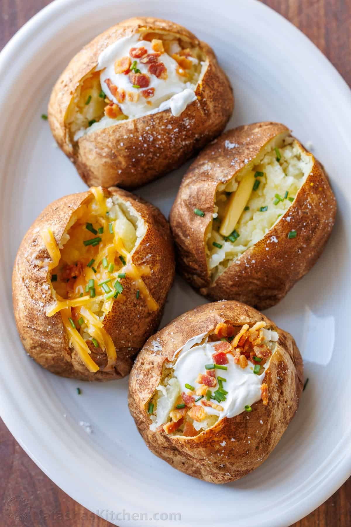 My easy Air Fryer Baked Potato recipe makes the best Baked Potatoes. You'll love the crispy skin with a soft and fluffy center in less time!