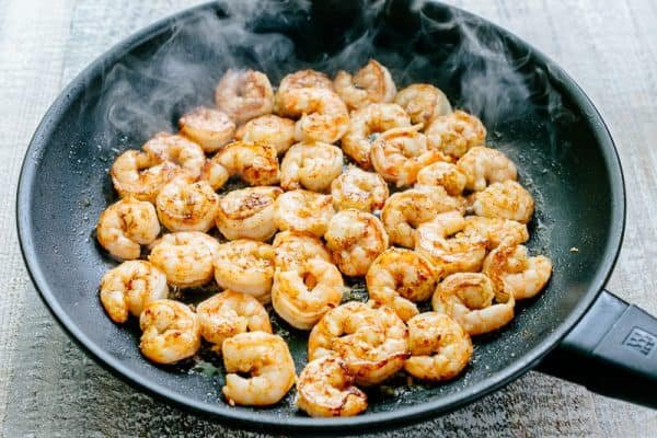 We could live off this shrimp avocado salad. It's crazy good and loaded with avocado, cucumbers, tomatoes, sweet corn and tossed with a light and easy cilantro-lemon dressing. This shrimp salad has all the best flavors of summer! WINNER!! | natashaskitchen.com
