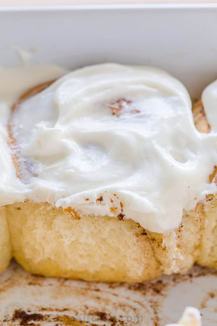 Soft sweet bun with the best cream cheese icing and they always disappear fast. As my sister puts it, they are "better than Cinnabon!" #cinnamonrolls #cinnamonrollrecipe #cinnamonrollsrecipe #sweetbuns #cinnamonrollsicing #natashaskitchen #thanksgiving #christmas Single reheated glazed sweet bun in the pan