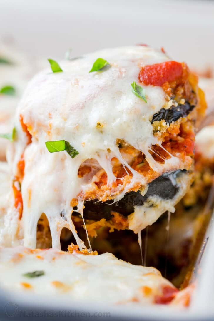 This Eggplant Parmesan recipe has crisp baked eggplant, flavorful marinara, and plenty of melted cheese to replicate a classic Italian dish. Mouthwatering slice of Baked Eggplant Parmesan