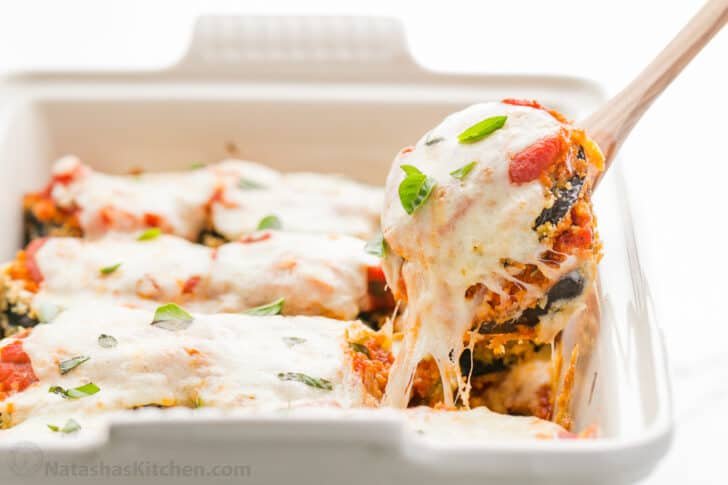 This Baked Eggplant Parmesan recipe fills your mouth with crisp eggplant, flavorful marinara, and plenty of melted cheese to replicate a classic Italian dish. Eggplant Parmesan with delicious melted mozzarella cheese - ready to serve