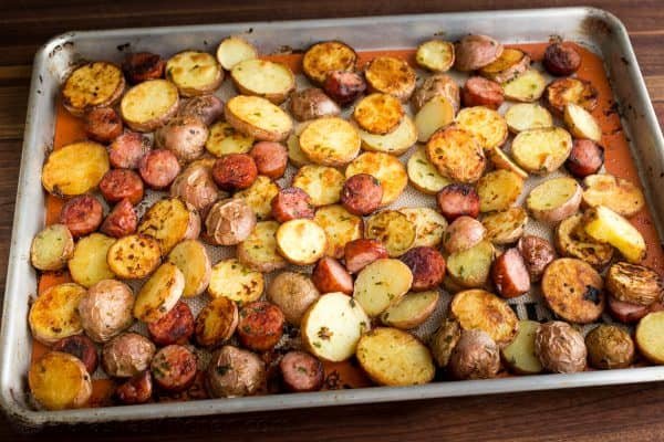 These roasted potatoes are ultra crispy and flavorful with a perfect browning on the coins of kielbasa. Easy, one-pan roasted potatoes and sausage recipe | natashaskitchen.com