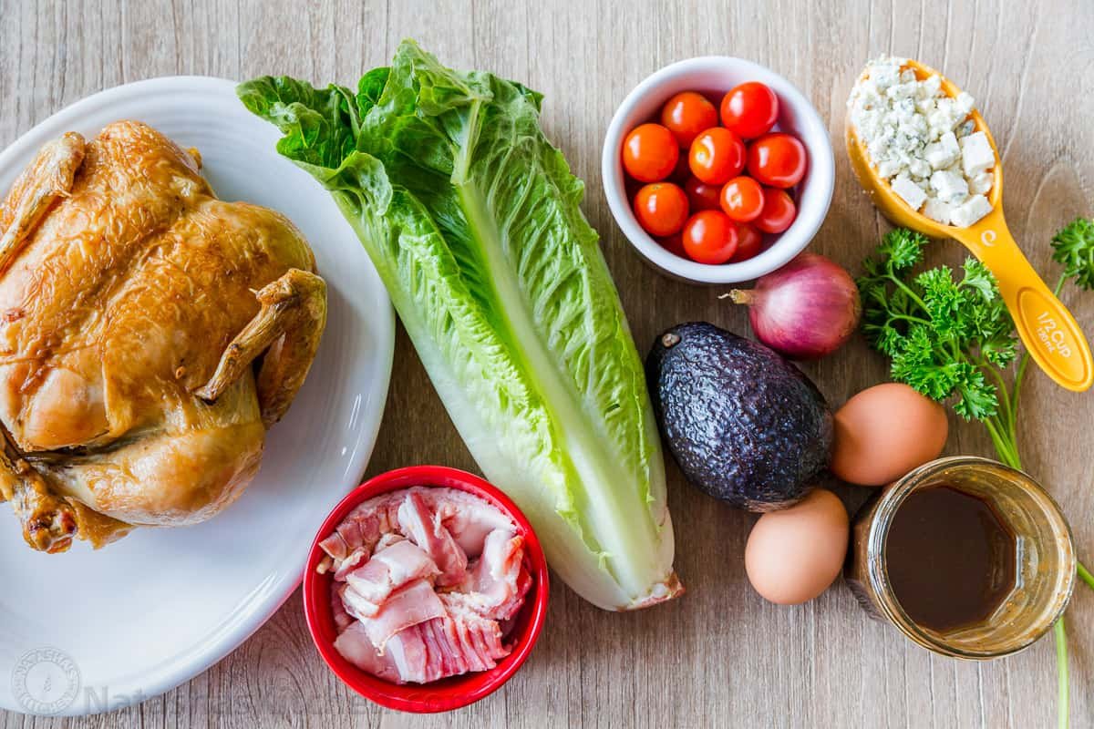 Easy Chicken Cobb Salad with the Best Cobb Salad Dressing! A protein-packed salad loaded with lettuce, tomatoes, chicken, avocado and cheese. Cobb salad ingredients with chicken, lettuce, bacon, avocado, cheese and dressing