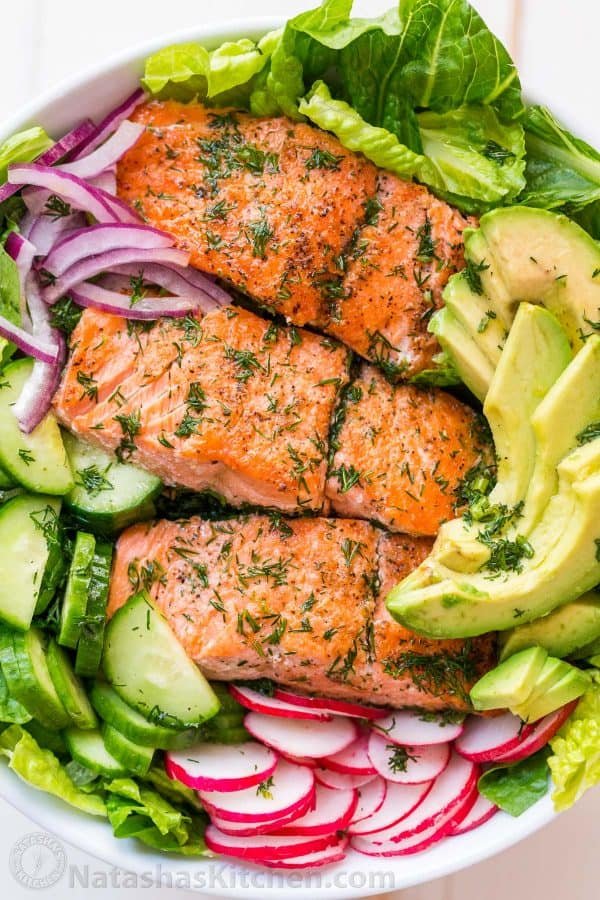 This avocado salmon salad recipe is loaded with all of the best salad ingredients; crisp cucumber and lettuce, and juicy pan seared salmon. The lemon dill dressing is so easy and gives this salmon salad amazing fresh flavor. 