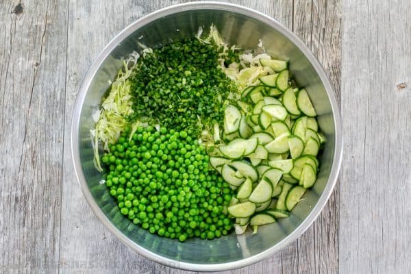 This cabbage and pea salad is vibrant, crisp and fresh. I love the sweet pop of flavor from the peas and the easy zesty dressing. A must try cabbage salad! | natashaskitchen.com