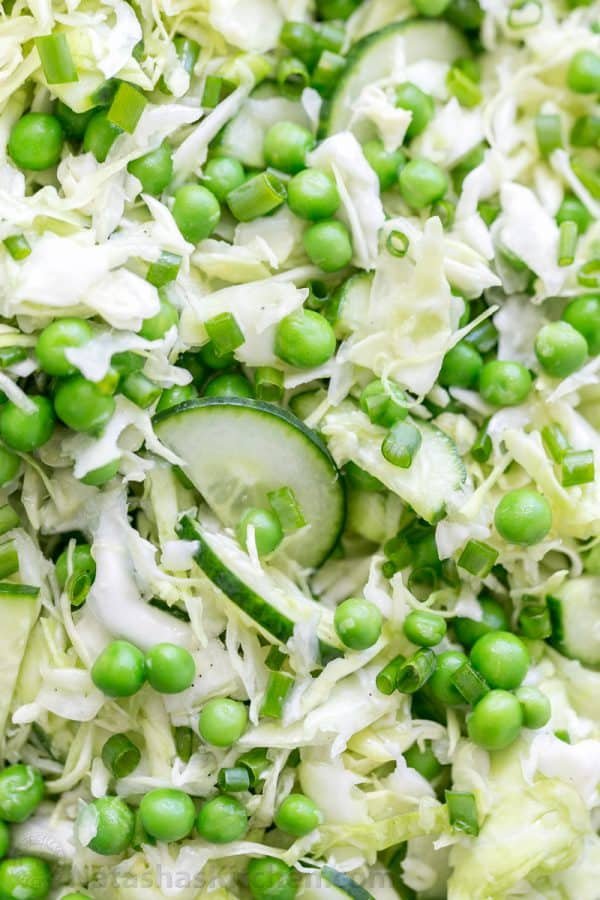 This cabbage and pea salad is vibrant, crisp and fresh. I love the sweet pop of flavor from the peas and the easy zesty dressing. A must try cabbage salad! | natashaskitchen.com