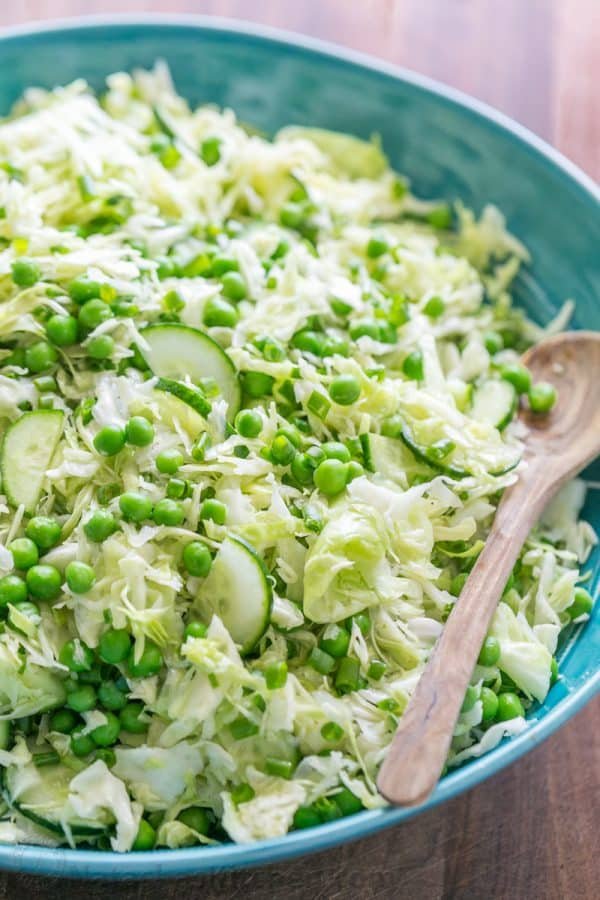 This cabbage and pea salad is vibrant, crisp and fresh. I love the sweet pop of flavor from the peas and the easy zesty dressing. A must try cabbage salad! | natashaskitchen.com