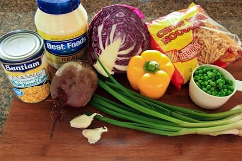 Ingredients on a cutting board for a red cabbage wreath salad 