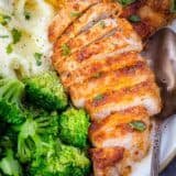 Air Fryer Pork Chops on a plate with broccoli and potatoes