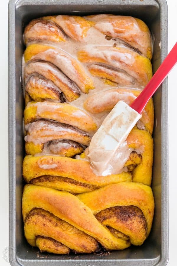 You'll make this Pumpkin Bread over and over. Cinnamon rolls + pumpkin pie + amazing cinnamon glaze = this pull-apart pumpkin bread! It melts in your mouth! | natashaskitchen.com