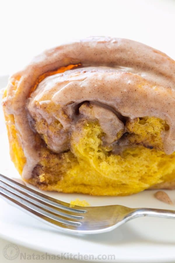 You'll make this Pumpkin Bread over and over. Cinnamon rolls + pumpkin pie + amazing cinnamon glaze = this pull-apart pumpkin bread! It melts in your mouth! | natashaskitchen.com