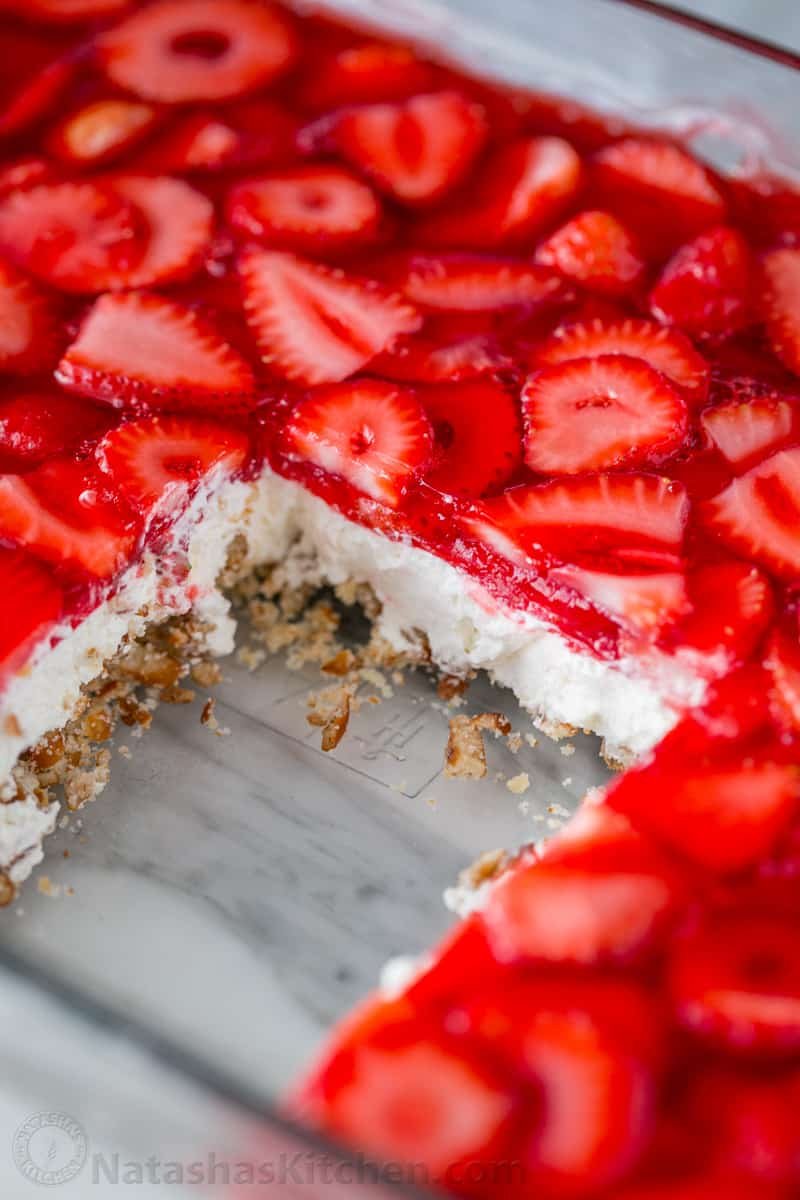 This strawberry pretzel salad is always a hit at parties. It's a strawberry jello dessert that is dangerously good! It's sweet, salty, tart and irresistible!