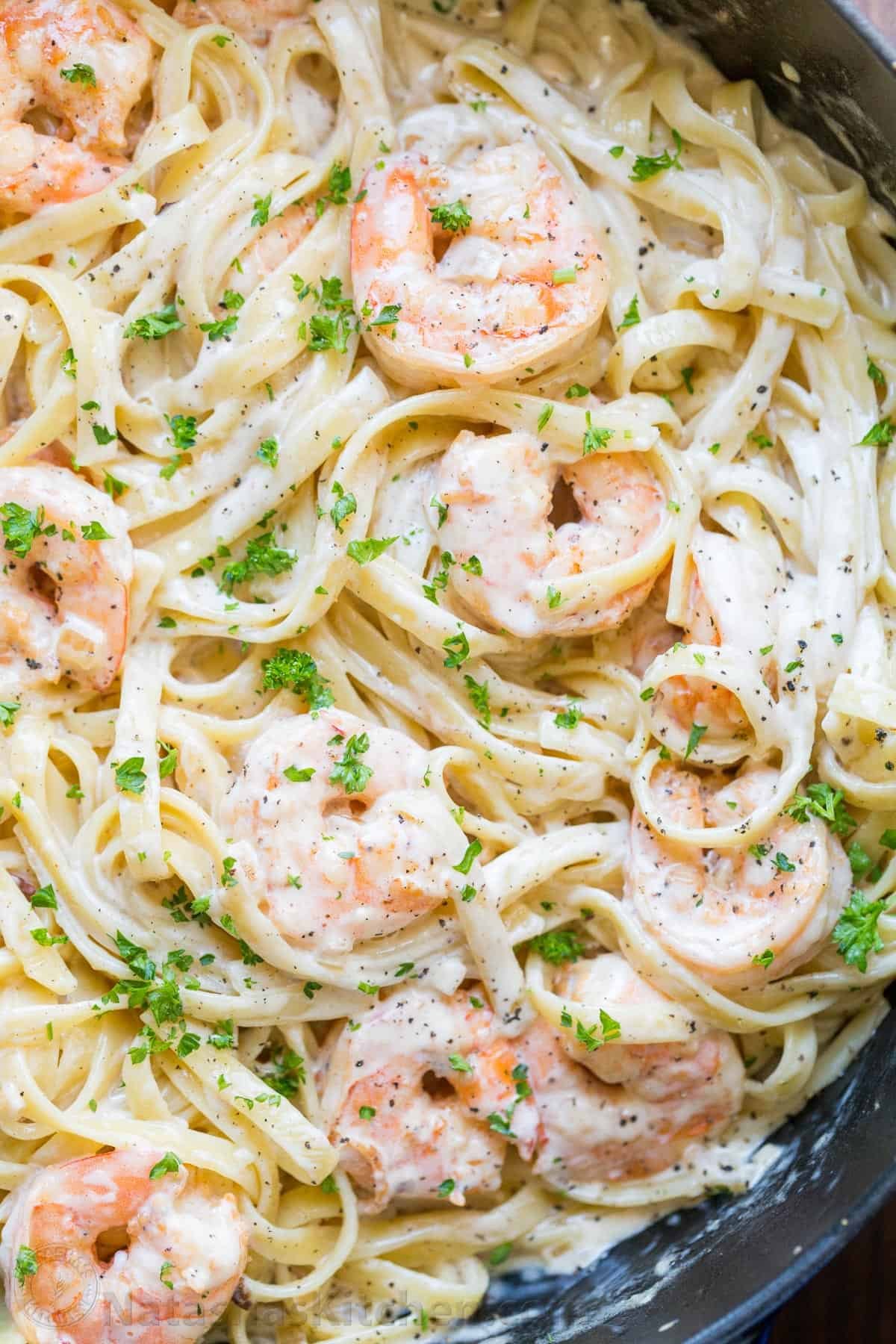 Creamy Shrimp Pasta reminds me of my favorite dish at Olive Garden with plump juicy shrimp and the easiest alfredo sauce. Rave reviews on this shrimp pasta! | natashaskitchen.com