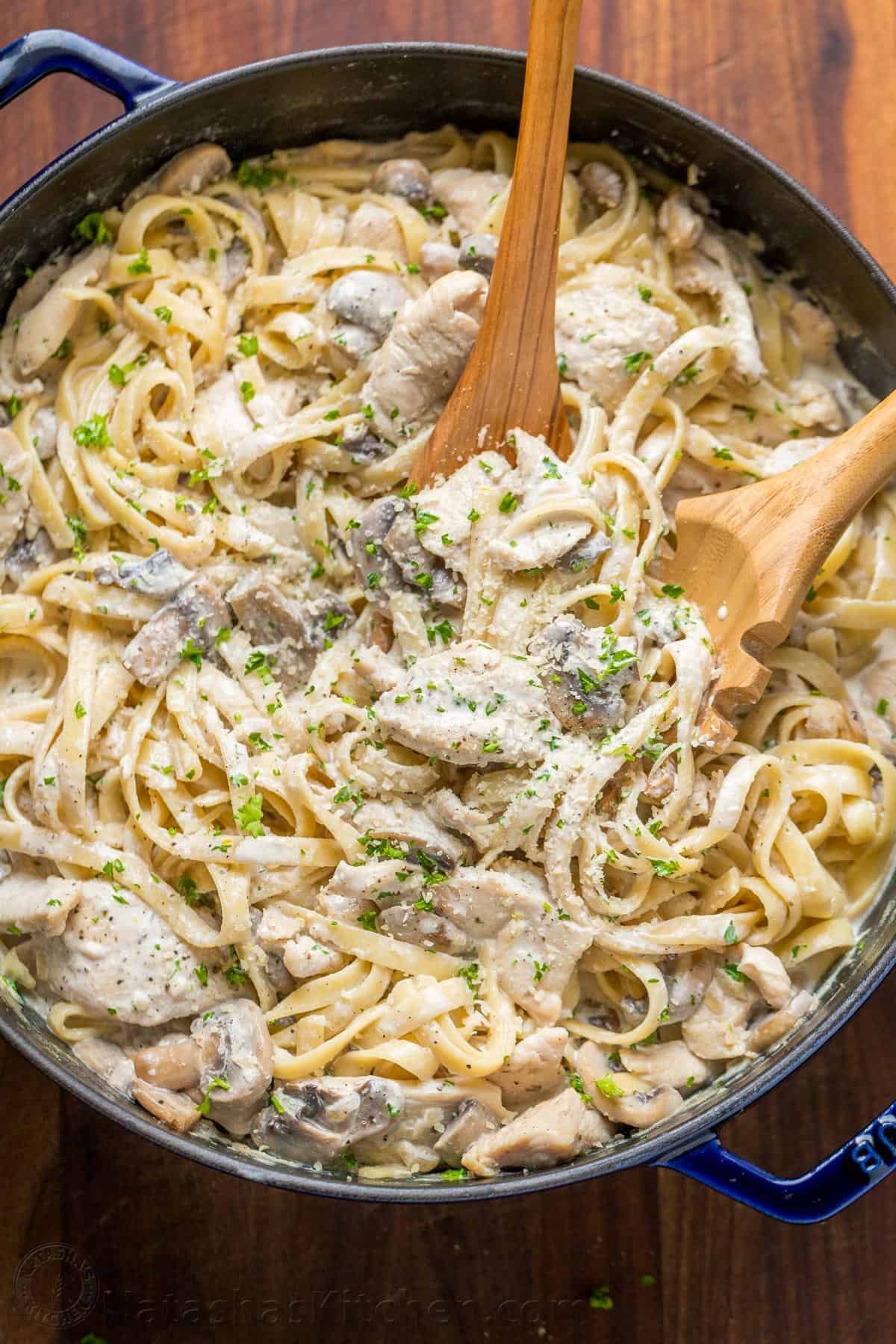 Mom's creamy Chicken Fettuccine Alfredo has been a family favorite for years! Classic Chicken Alfredo is a feel good comfort food - so creamy but light! | natashaskitchen.com