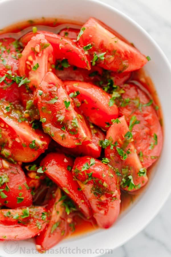 Addictively delicious! Served these marinated tomatoes at a potluck and everyone wanted the recipe! Marinated tomatoes are a great make-ahead side dish.