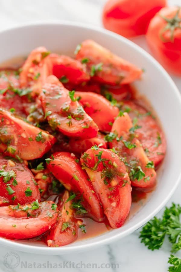 Addictively delicious! Served these marinated tomatoes at a potluck and everyone wanted the recipe! Marinated tomatoes are a great make-ahead side dish.
