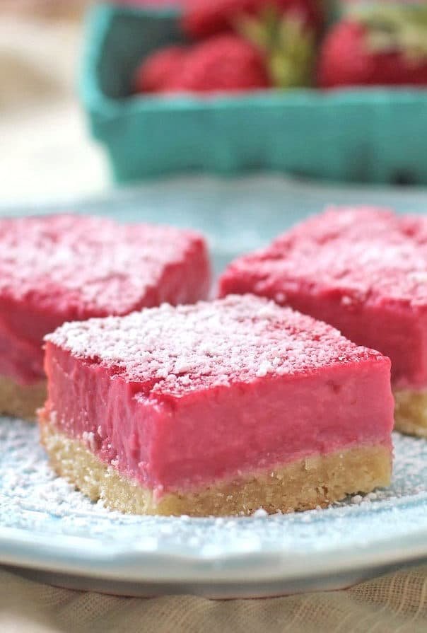 These Raspberry Lemon Bars are sweet, simple and satisfying. They taste like they're full of sugar and butter, but shhhh, they're healthy! You'd never guess these Pink Raspberry Lemonade Bars are sugar free, gluten free, dairy free, paleo, keto, and even high protein too!